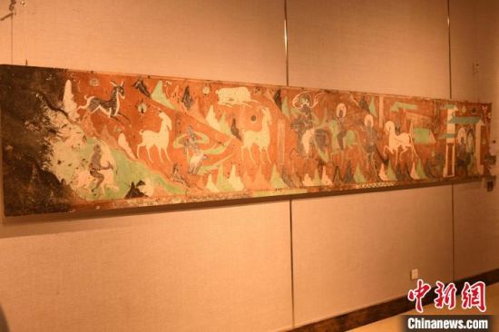 图为莫高窟第257窟壁画《鹿王本生》。 周毅 摄 图为莫高窟第257窟壁画《鹿王本生》。 周毅 摄